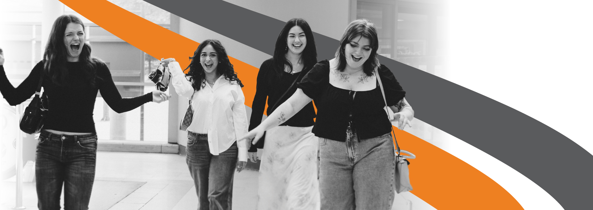 Four female passengers in a Subway station laughing